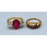 A yellow metal Amethyst and pearl set dress ring together with a three stone ring