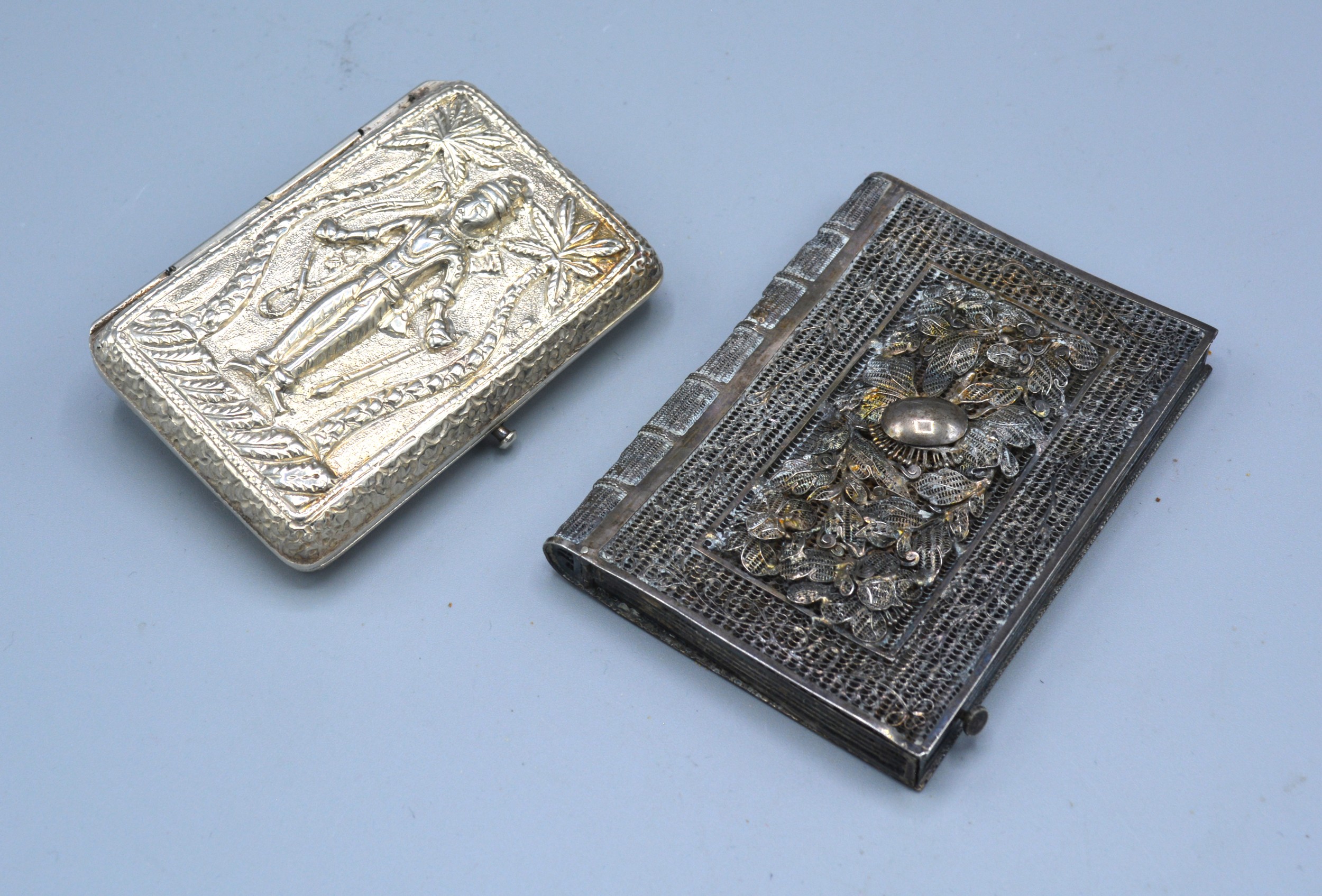 A Continental White Metal Card Case of pierced filigree form together with another similar card case