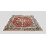 A North West Persian Style Woollen Carpet with a central medallion within an all over design on a