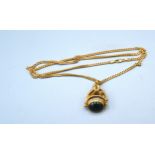 A 9ct. Gold Swivel Fob together with a 9ct. gold linked chain, 21.5 gms. 56 cms long
