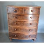 A Victorian Mahogany Bow Fronted Chest of two short and four long drawers with knob handles,
