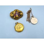 A Victorian Amethyst Set Brooch of scroll form together with two lockets and a chain