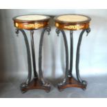 A Pair Of French Gilt Metal Mounted Torcheres, the marble inset tops above shaped supports with