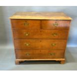 A Late 19th Century Oak Chest, the moulded top above two short and three long drawers with brass