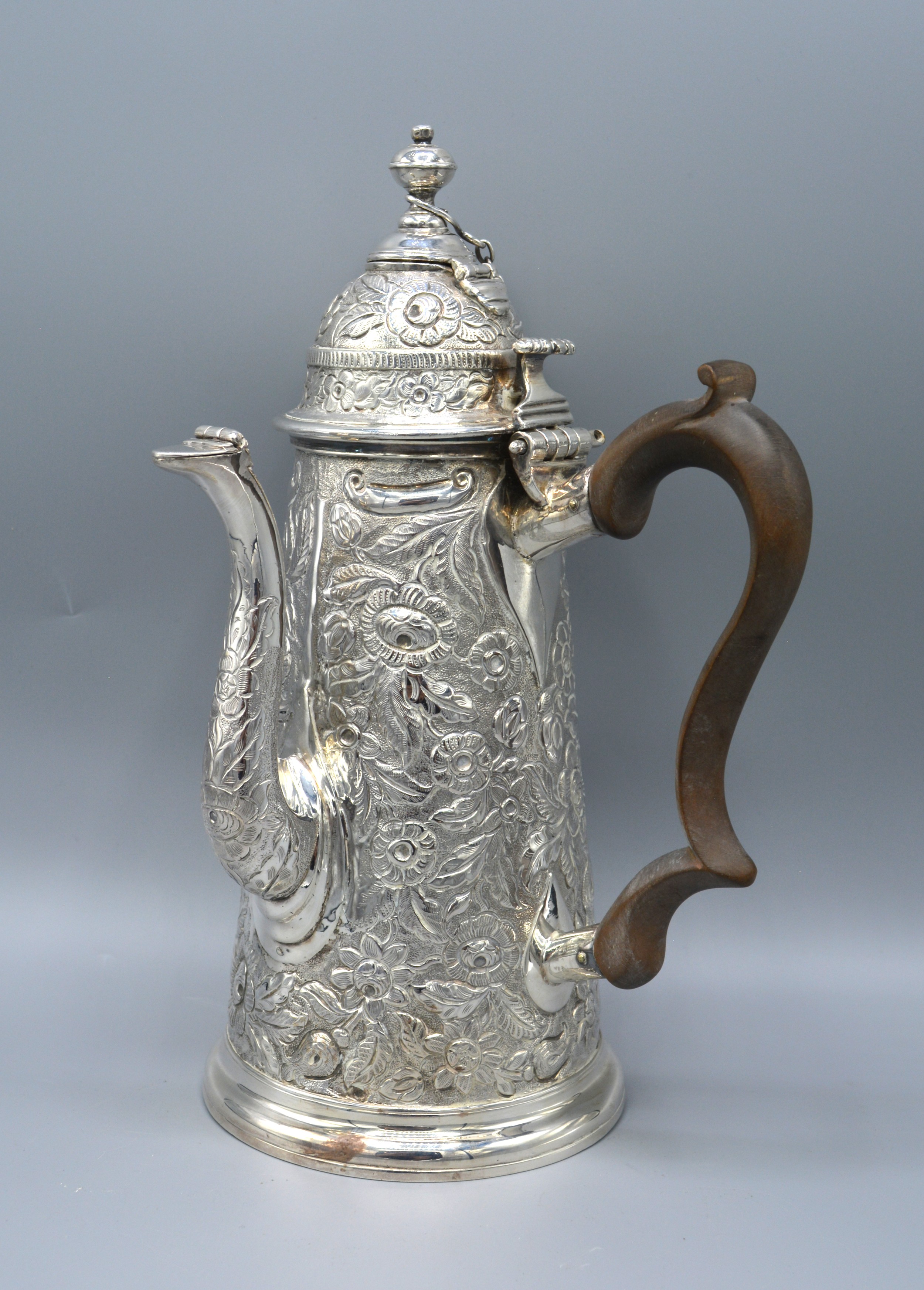 A Continental White Metal Chocolate Pot with shaped handle 24 ozs. 25 cms tall