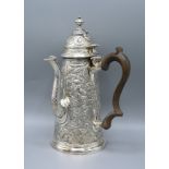 A Continental White Metal Chocolate Pot with shaped handle 24 ozs. 25 cms tall
