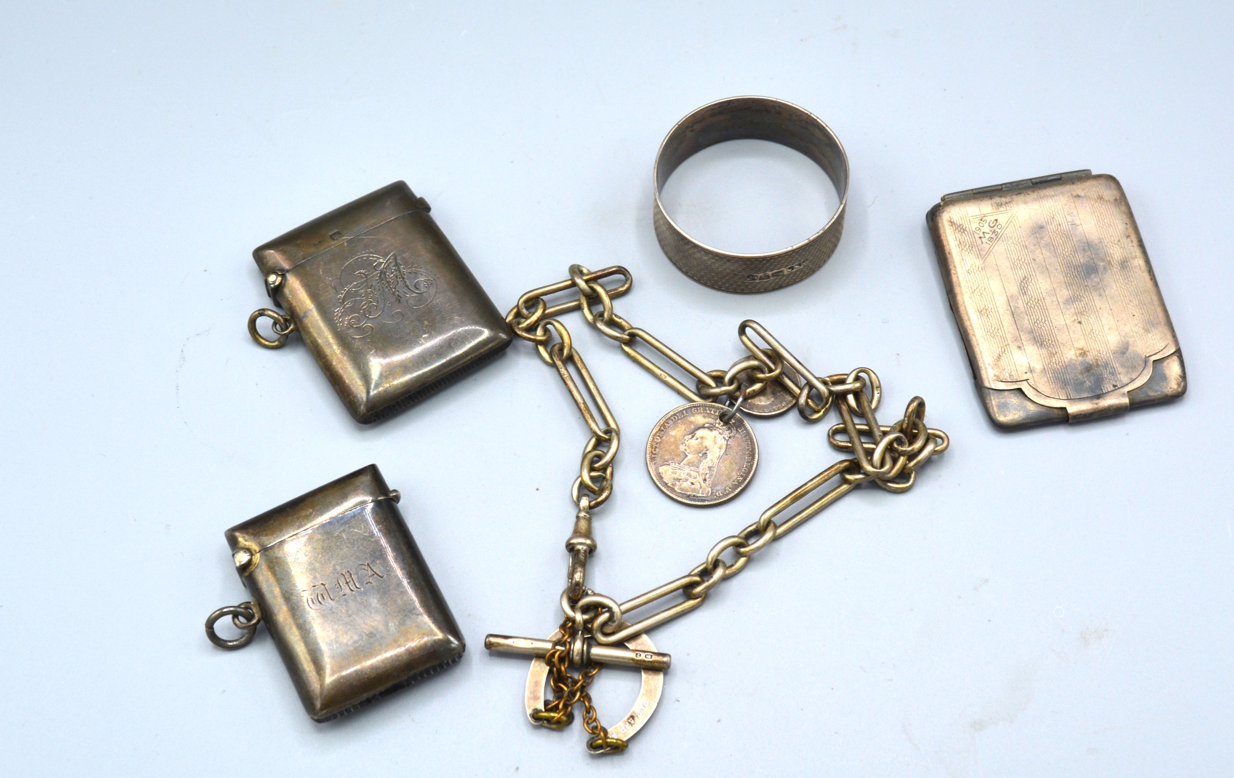 A Sheffield Silver Vesta Case together with a Birmingham silver vesta case, a Birmingham silver card