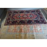 A North West Persian Woollen Rug with a triple centre medallion within an all over design upon a