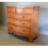 A 19th Century Mahogany Bow Fronted Chest of two short and three long drawers with circular brass