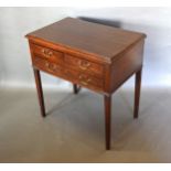 A 19th Century Oak Side Table, the moulded top above four drawers with brass handles raised upon
