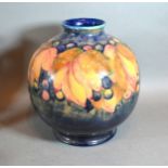 A William Moorcroft Leaf and Berry Pattern Tube Lined of large globular form 24 cms tall