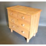 A Small Pine Chest, the moulded top above two short and two long drawers with knob handles, raised