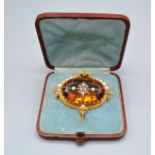 A 19th Century Brooch retailed by Tiffany & Co. set with a large citrine encrusted with