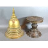 A Bronze And Copper Stupa with embossed decoration, 28cms tall together with a bronze stand of