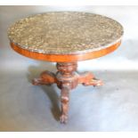 A 19th Century French Circular Centre Table, the variegated marble top above a plain frieze,