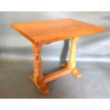 Robert (Mouseman) Thompson, A Rectangular Oak Hall Table with twin end octagonal supports and