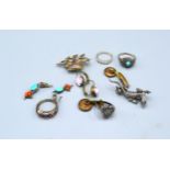 A Small Collection of Jewellery to include four dress rings, various brooches and ear studs