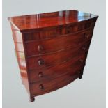 A Victorian Mahogany Bow Fronted Chest of Drawers, the shaped top above four drawers with knob