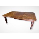 A Victorian Mahogany Pull Out Extending Dining Table, the moulded top above a plain frieze raised