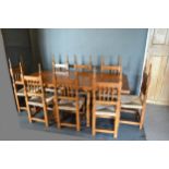 A Spanish Pine Refectory Style Dining Table together with a set of eight spindle back chairs, 182cms