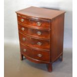 A Mahogany Bow Fronted Small Chest of four drawers with oval brass handles raised upon outswept