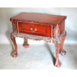 A 20th Century Side Table, the hinged top above a frieze drawer raised upon carved cabriole legs