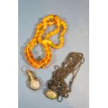 An Amber Coloured Bead Necklace together with another necklace set cabochon hard stone and a small