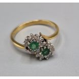 A 9t gold Emerald and diamond set crossover ring, (one stone missing) ring size N, 2.1grams