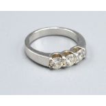 A White Metal Three Stone Diamond Ring, the three diamonds claw set, 5.6gms. ring size L