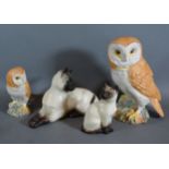 A Beswick model in the form of an owl together with another similar smaller and two Beswick models