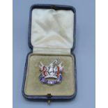A 9ct gold Military brooch set with red and blue enamel, 6.8 grams