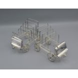 A pair of four division toast racks in the form of cars, 12cms tall