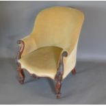 A 19th Century mahogany drawing room armchair with scroll arms and raised upon cabriole legs and