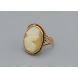 A 9ct gold ring set with an oval cameo, 2.7 grams, ring size G