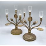 A Pair of Brass Three Branch Candelabrum of Flower Head and Leaf Form upon shaped circular bases,