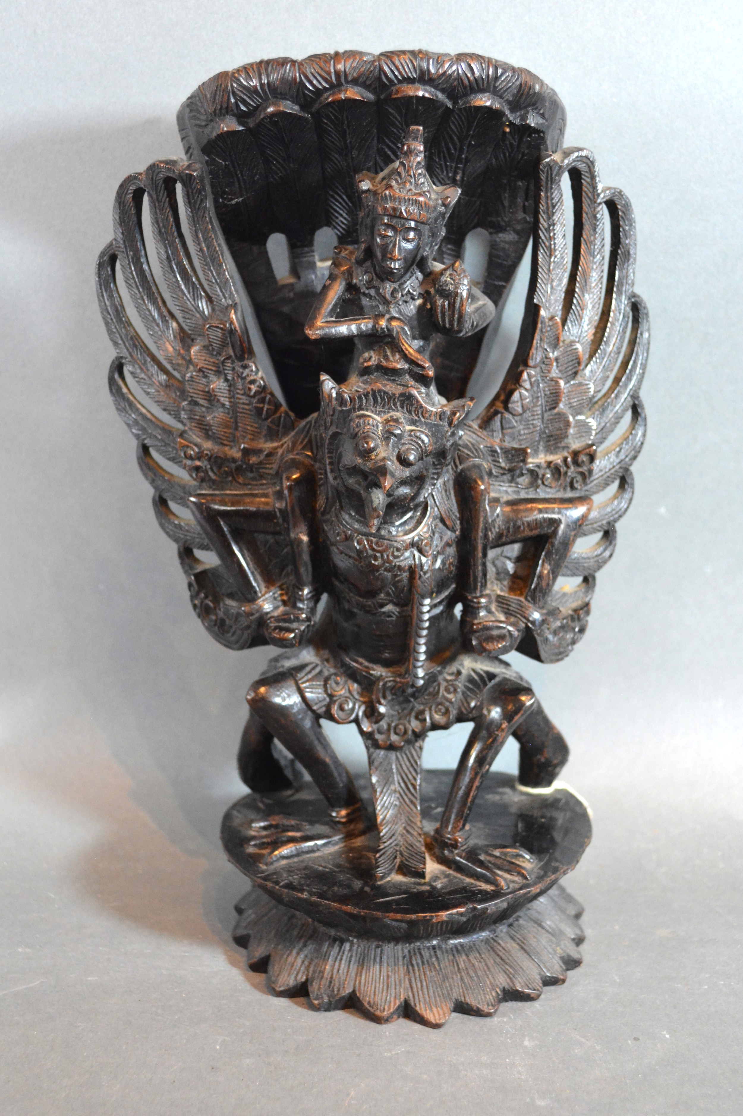 A Balinese Wooden Carving of Vishnu and Garuda 30cms tall
