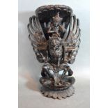 A Balinese Wooden Carving of Vishnu and Garuda 30cms tall