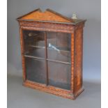 A 19th Century Dutch Marquetry inlaid display cabinet, with two glazed doors enclosing shelves above