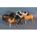 A Beswick model in the form of horse together with three other Beswick horses and a Beswick pony