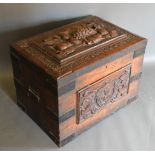 A Chest, the hinged top with carved panel above a similar front with end handles, 80 cms wide, 56