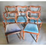 A Set Of Four Victorian Mahogany Dining Chairs, each with a carved rail back above a drop in seat,