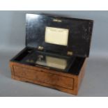 A 19th Century Swiss music box, with burr walnut and ebonised case, playing eight airs, 36cms long