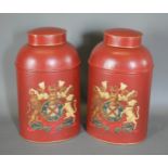 A pair of Toleware large covered cannisters, each with a gilded Armorial upon a red ground, 44cms
