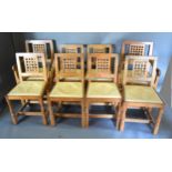 Robert (Mouseman) Thompson, A Set Of Eight (two arms and six singles) Oak Dining Chairs each with