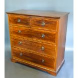 An Edwardian Mahogany Straight Front Chest of two short and three long drawers with circular brass