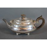 An Edwardian Silver Teapot of oval half lobed form, London 1909, Goldsmiths & Silversmiths