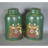 A pair of Toleware covered cannister, each with a gilded Armorial upon a green ground, 44cms tall