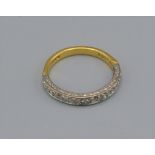 A 18ct gold half eternity ring set with eleven diamonds, 3.3 grams, ring size N