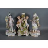 A pair of German porcelain figures decorated in polychrome enamels and highlighted with gilt,