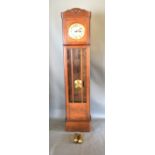 An Art Deco Long Case Clock, the circular dial with Arabic numerals, 218cms tall
